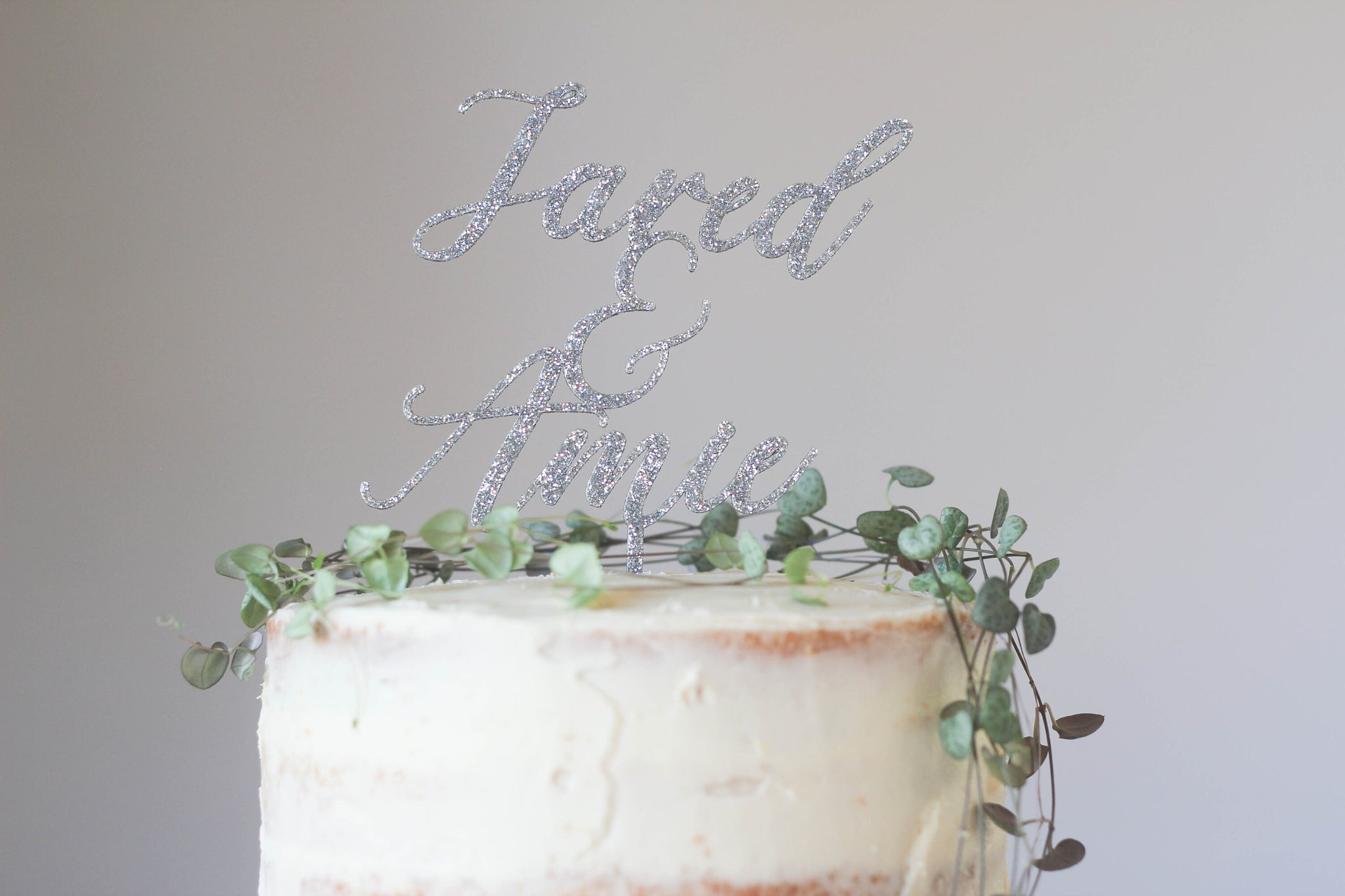 Cursive Wedding Cake Topper Featuring The Wedding Pairs Names