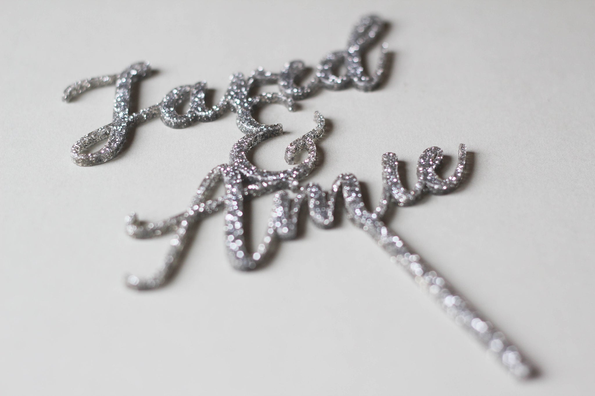 Cursive Wedding Cake Topper Featuring The Wedding Pairs Names